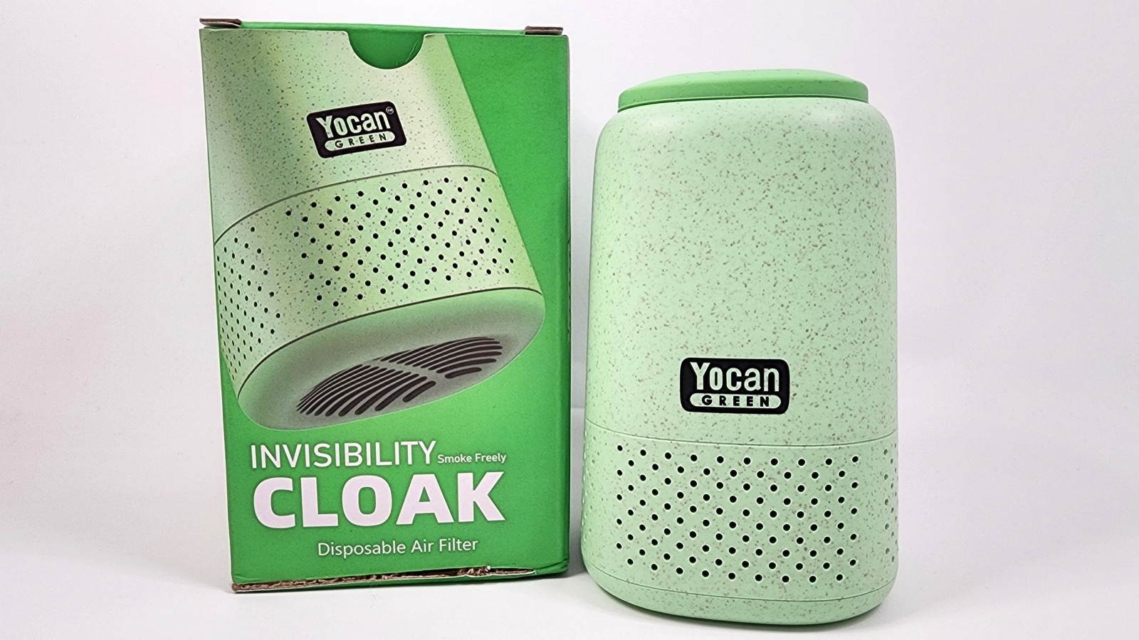 Yocan Invisibility Cloak air filter device placed next to its packaging box